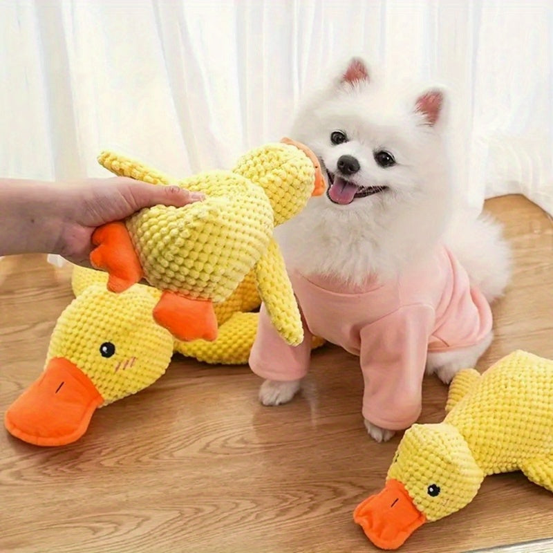 Large plush duck dog toy on floor