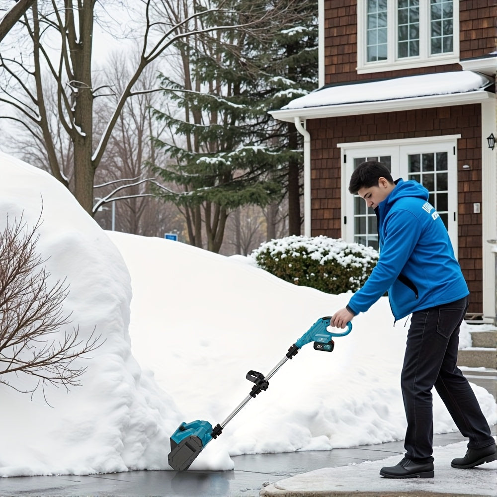 Cordless electric snow shovel clearing snow on driveway