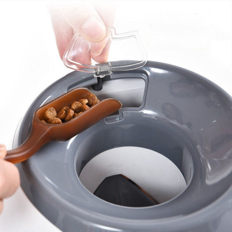 Dog treat dispenser toy showing snack release opening